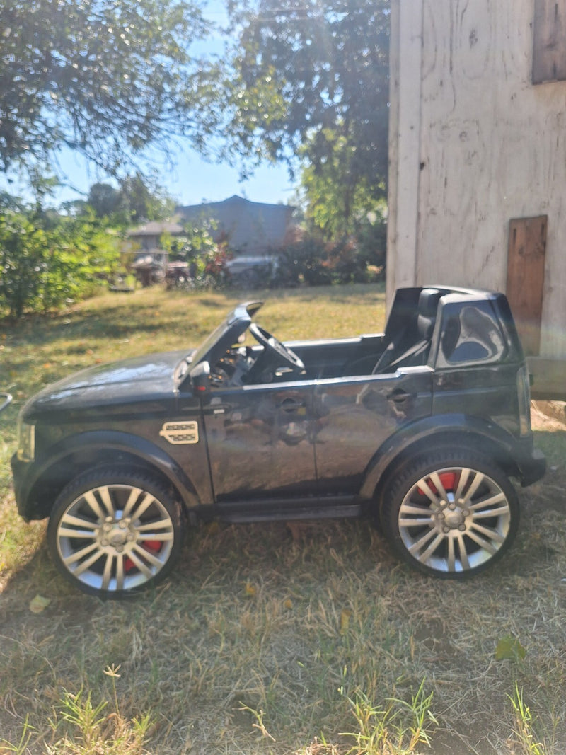 24V 2-Seater Licensed Land Rover Kids Ride-On Car with 4WD and Remote Control Magic Cars 1