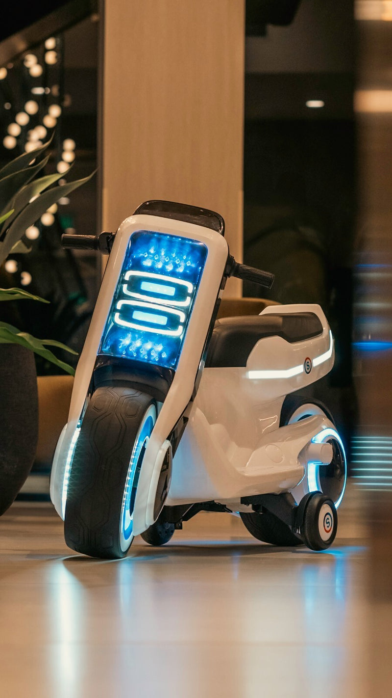 Electric Kids Ride-On Scooter Motorcycle Toy with LED Lights and Music, Tron-Inspired Design Magic Cars 6