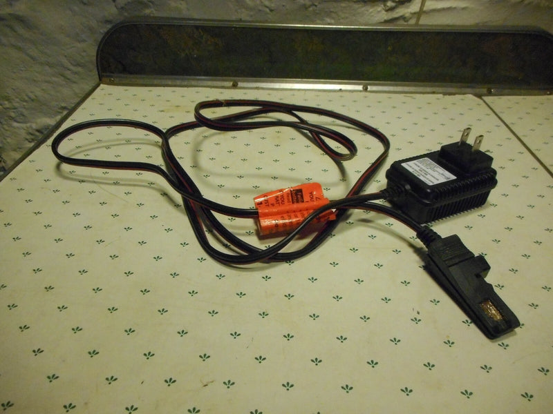 Grey Battery-Powered Wheels with AC/DC Adapter and Charger Cord Magic Cars 1