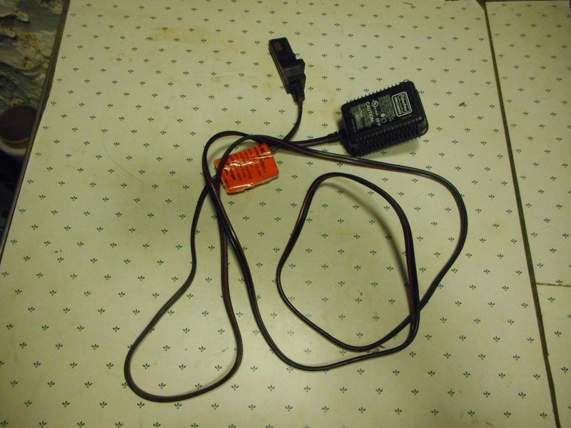 Grey Battery-Powered Wheels with AC/DC Adapter and Charger Cord Magic Cars 2