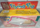 VINTAGE BATTERY-POWERED FLYING PIG TOY