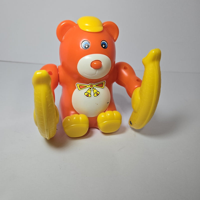 Animated Orange Monkey Toy with Yellow Hat Patent Pending