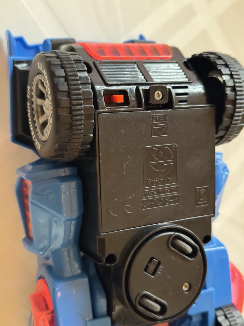 Mechanical Transforming Dinosaur Car Toy with LED Lights and Sound in Blue and Red