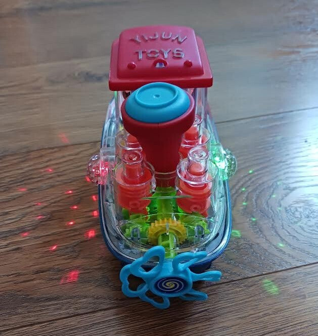 Plastic Bump N Go Tugboat Toy with Lights, Movement, and Music
