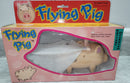 VINTAGE BATTERY-POWERED FLYING PIG TOY