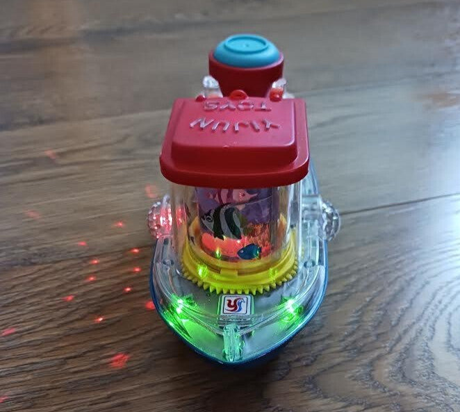 Plastic Bump N Go Tugboat Toy with Lights, Movement, and Music