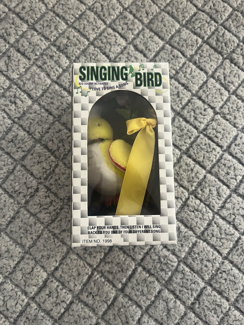 Battery-Operated Yellow Singing Bird Toy with Clap-Activated Sound, Chain, and Perch