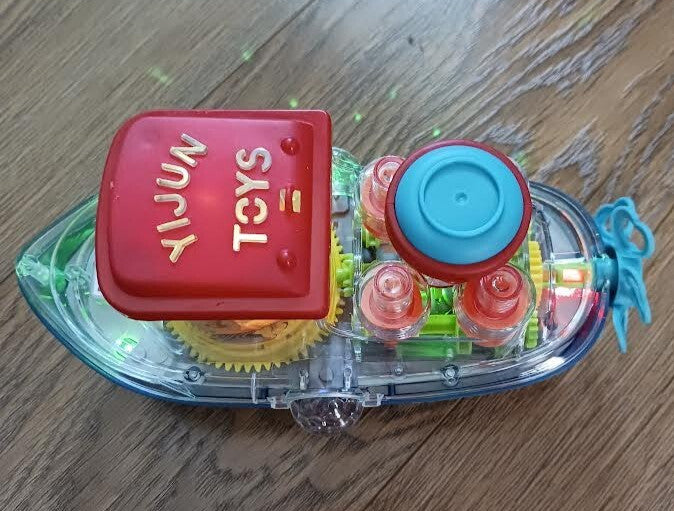 Plastic Bump N Go Tugboat Toy with Lights, Movement, and Music