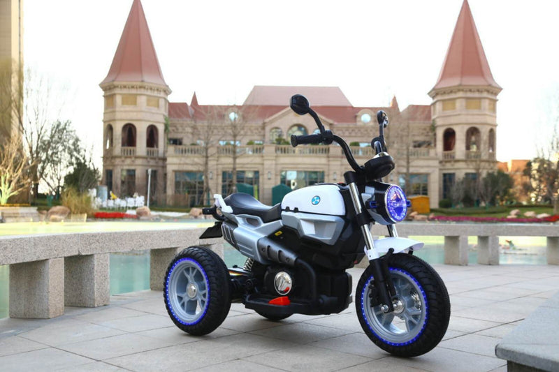 12V Kids Ride-On Motorcycle with 3 Wheels, LED Lights, and Audio Features Magic Cars 1