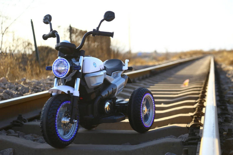 12V Kids Ride-On Motorcycle with 3 Wheels, LED Lights, and Audio Features Magic Cars 2