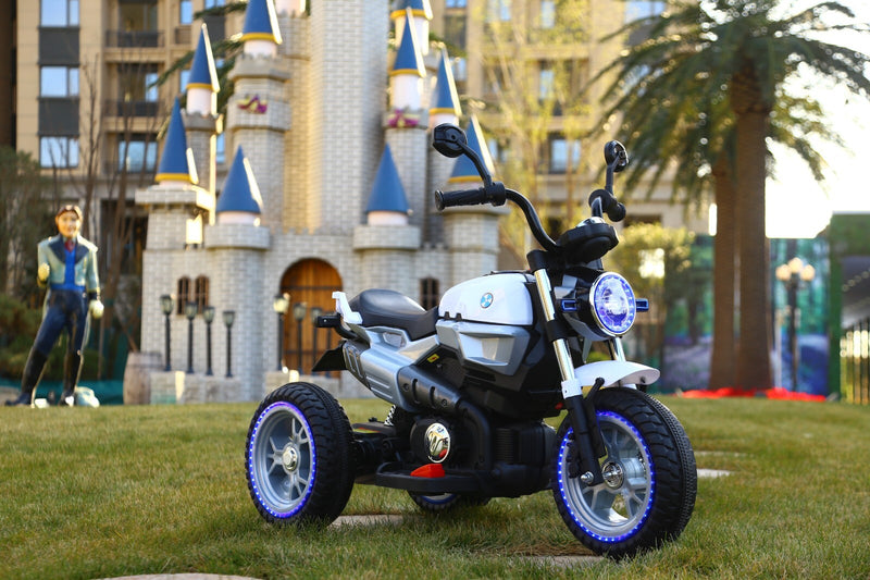 12V Kids Ride-On Motorcycle with 3 Wheels, LED Lights, and Audio Features Magic Cars 3