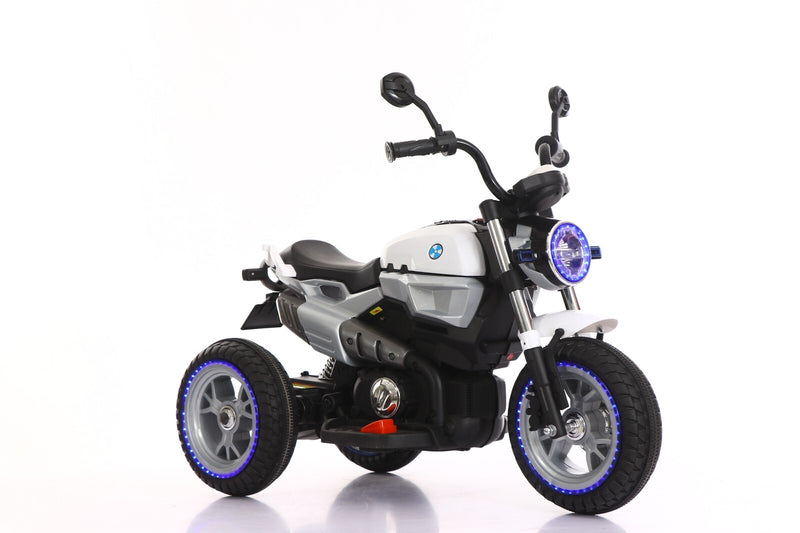 12V Kids Ride-On Motorcycle with 3 Wheels, LED Lights, and Audio Features Magic Cars 4