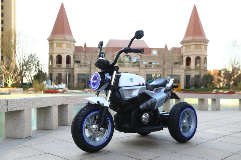 12V Kids Ride-On Motorcycle with 3 Wheels, LED Lights, and Audio Features Magic Cars Variant 0
